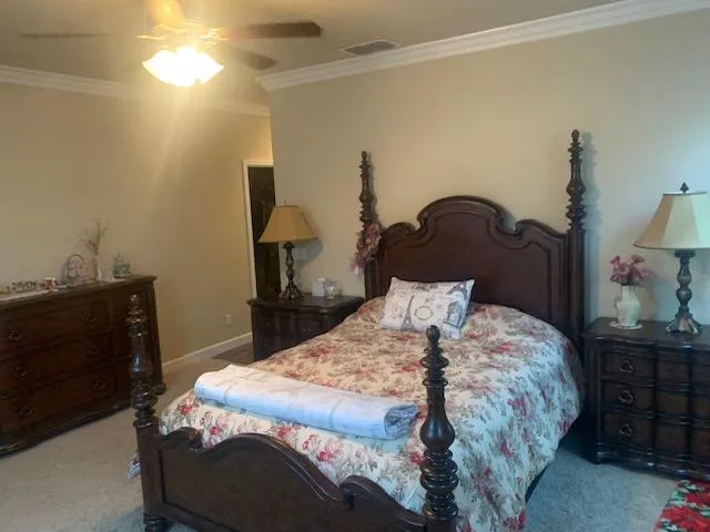 a bedroom with a bed and a dresser