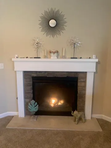 a bathroom with a fireplace and a sink