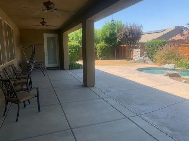 a view of swimming pool with seating space