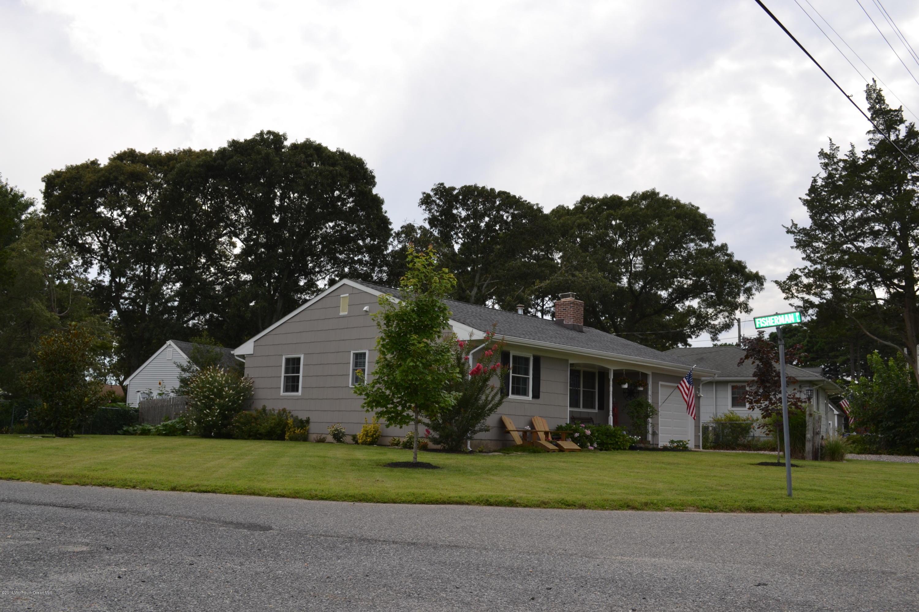 647 Harbor Road Brick, NJ 08724 - Photo 3 of 17 a front view of a house with a yard and garage