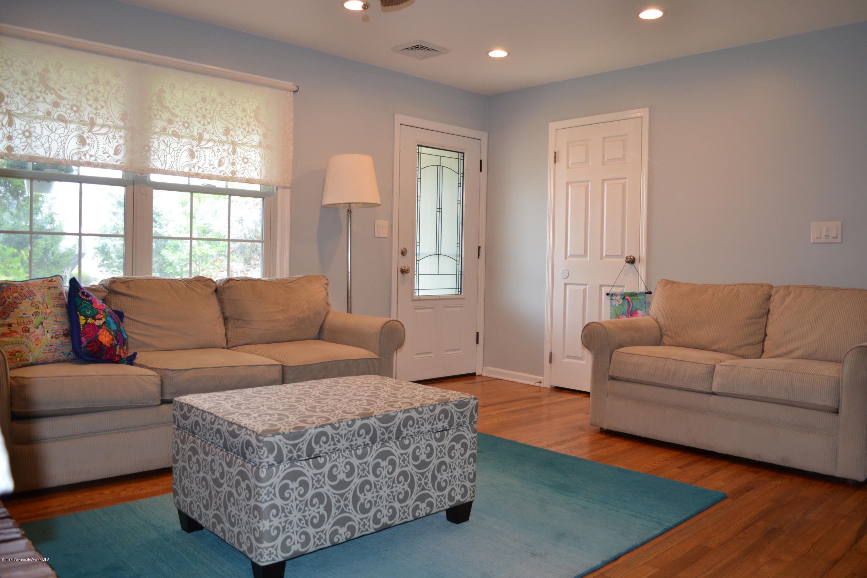 647 Harbor Road Brick, NJ 08724 - Photo 8 of 17 a living room with furniture and a large window