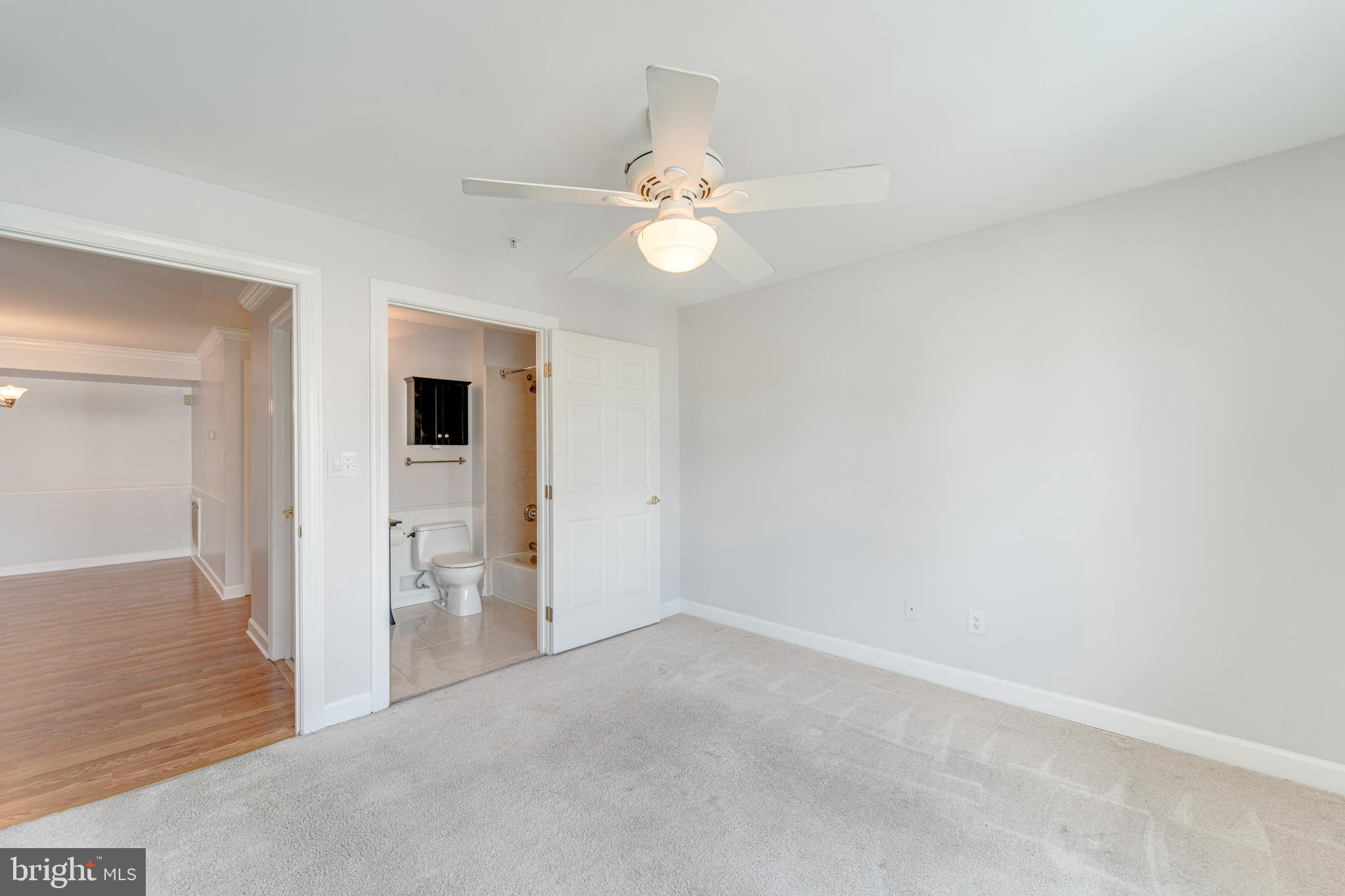 9220 Cardinal Forest Lane, Unit E Lorton, VA 22079 - Photo 15 of 26 an empty room with closet and a ceiling fan