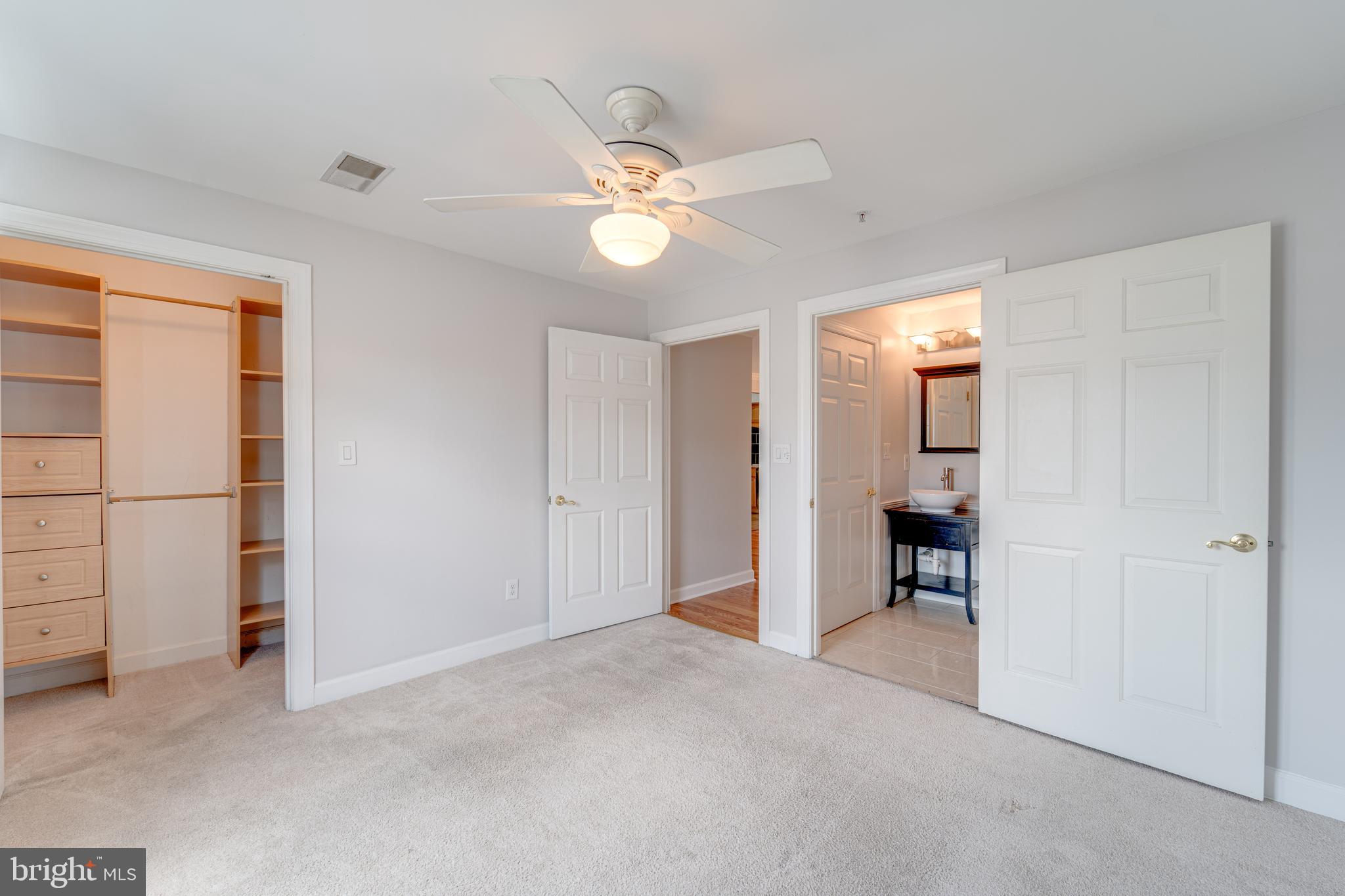 9220 Cardinal Forest Lane, Unit E Lorton, VA 22079 - Photo 16 of 26 a view of a room with closet and ceiling fan