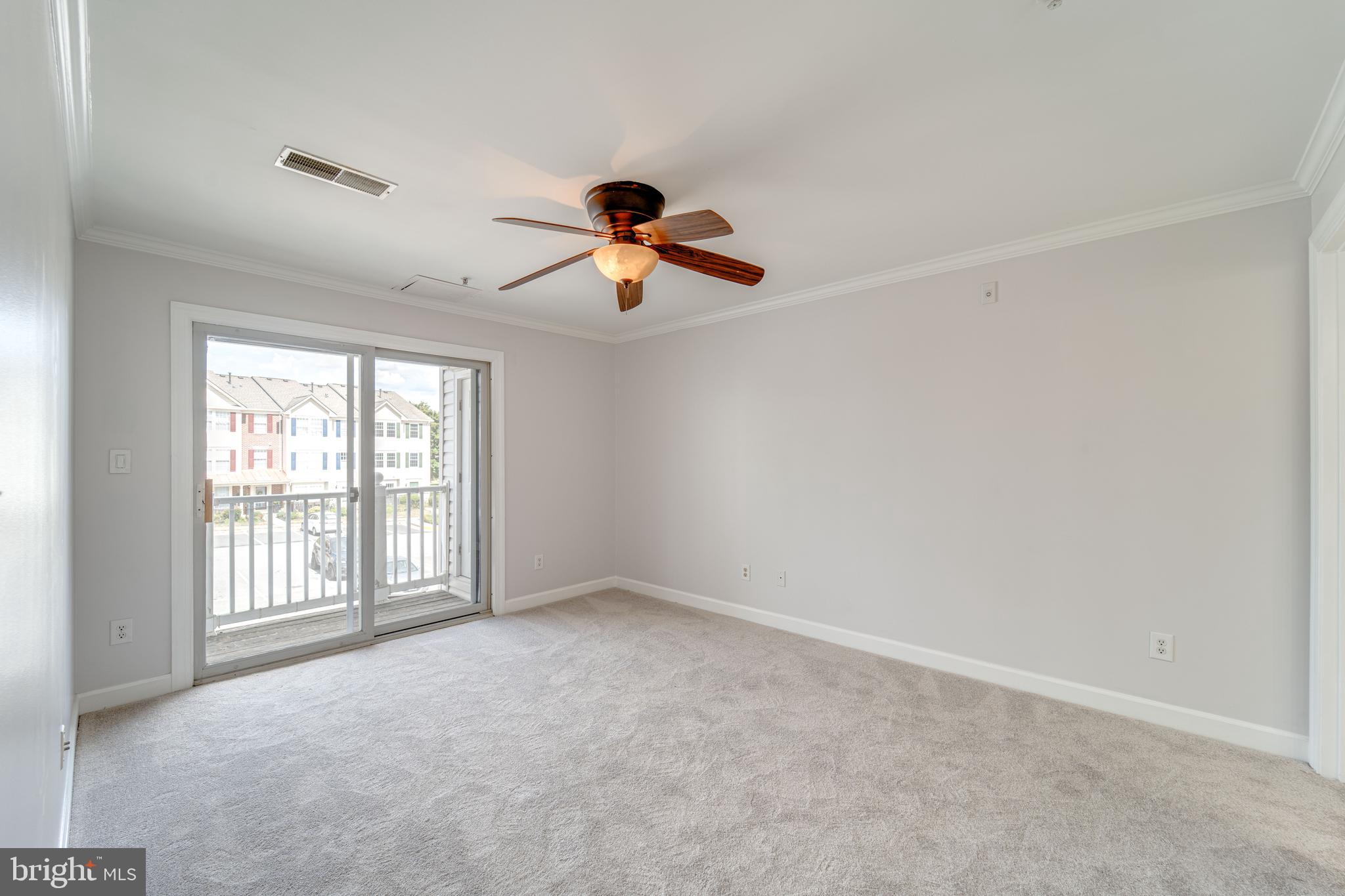 9220 Cardinal Forest Lane, Unit E Lorton, VA 22079 - Photo 18 of 26 wooden floor in an empty room with a window