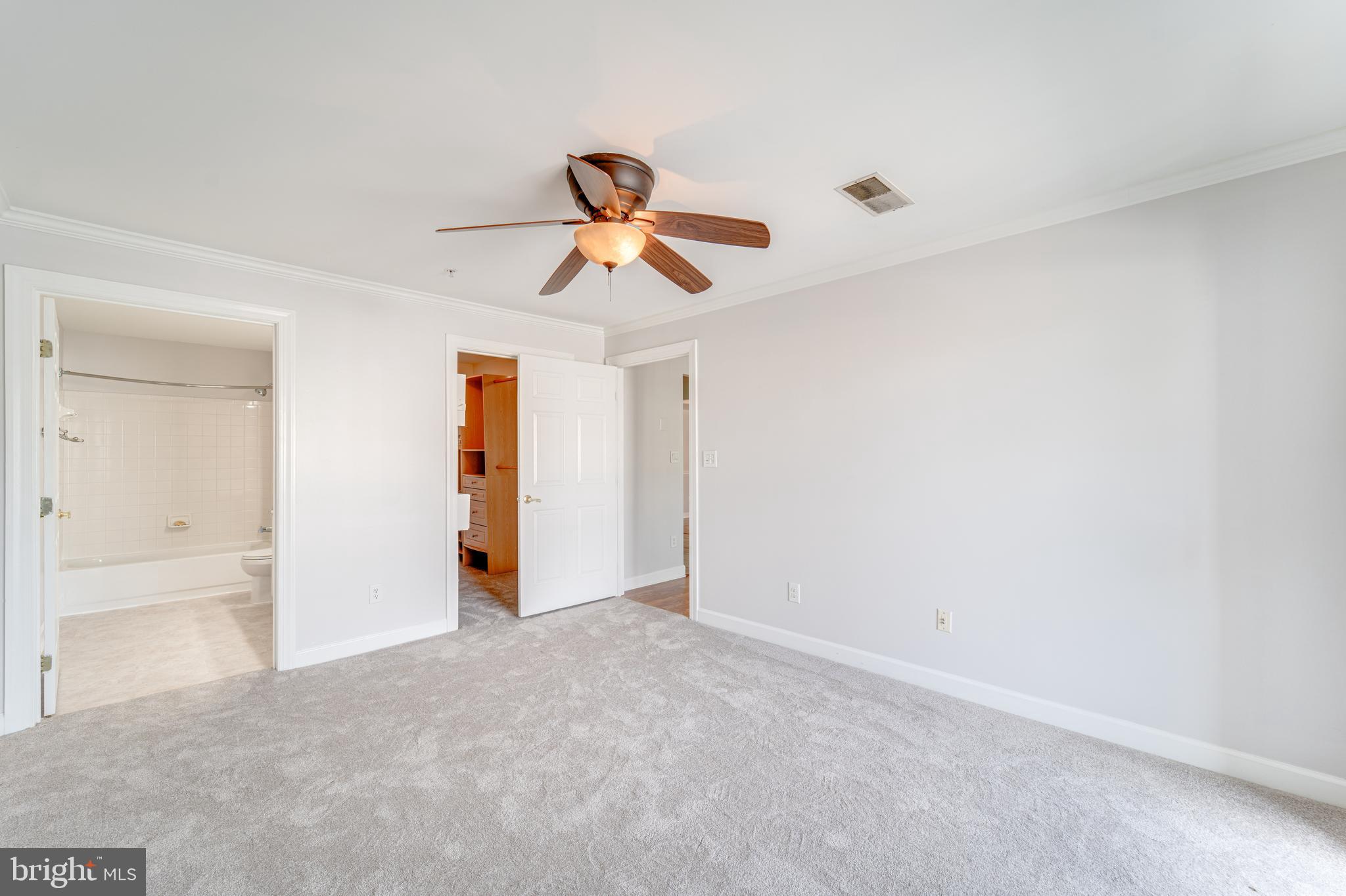 9220 Cardinal Forest Lane, Unit E Lorton, VA 22079 - Photo 19 of 26 a view of a room with a ceiling fan and window