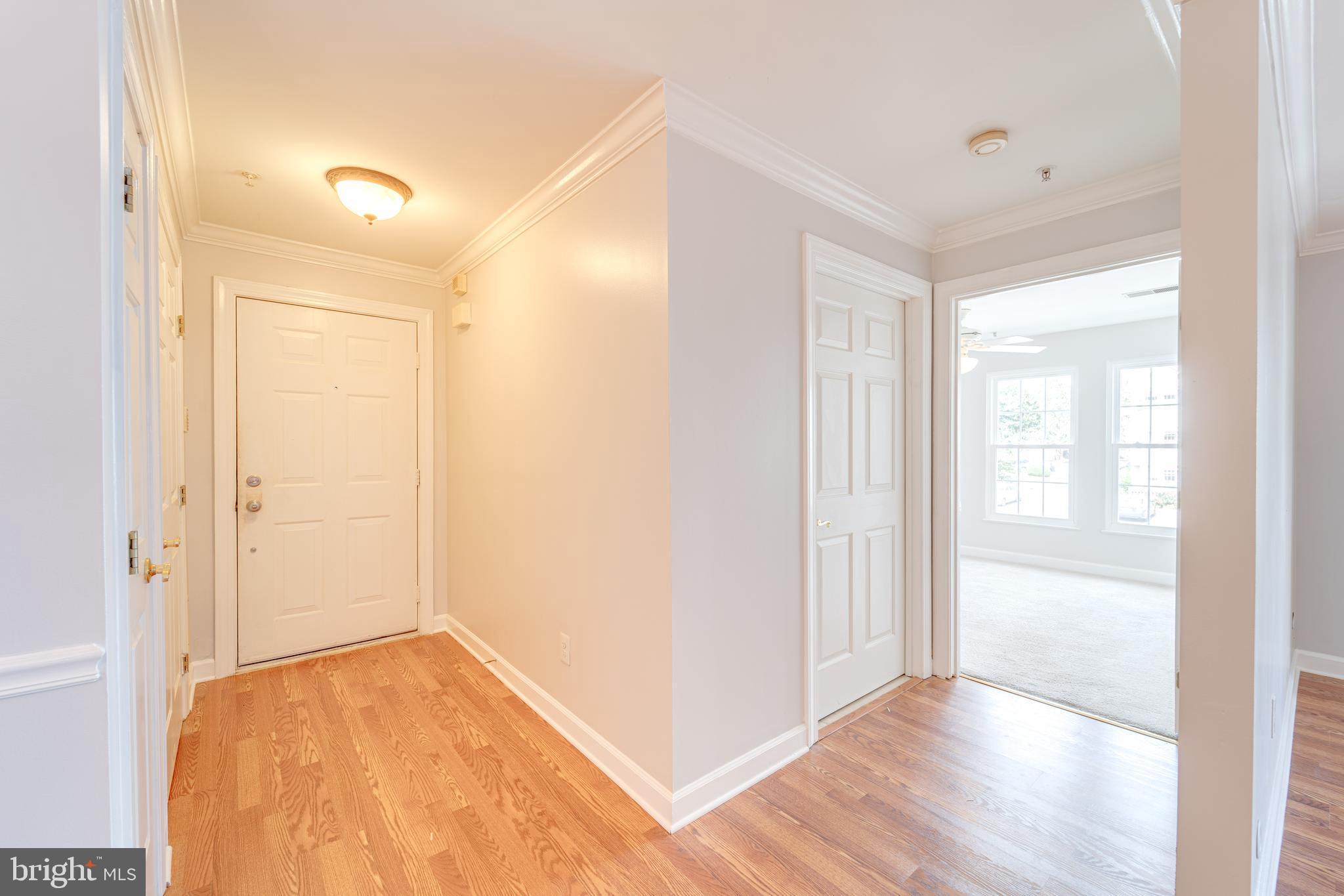 9220 Cardinal Forest Lane, Unit E Lorton, VA 22079 - Photo 2 of 26 a view of empty room with wooden floor