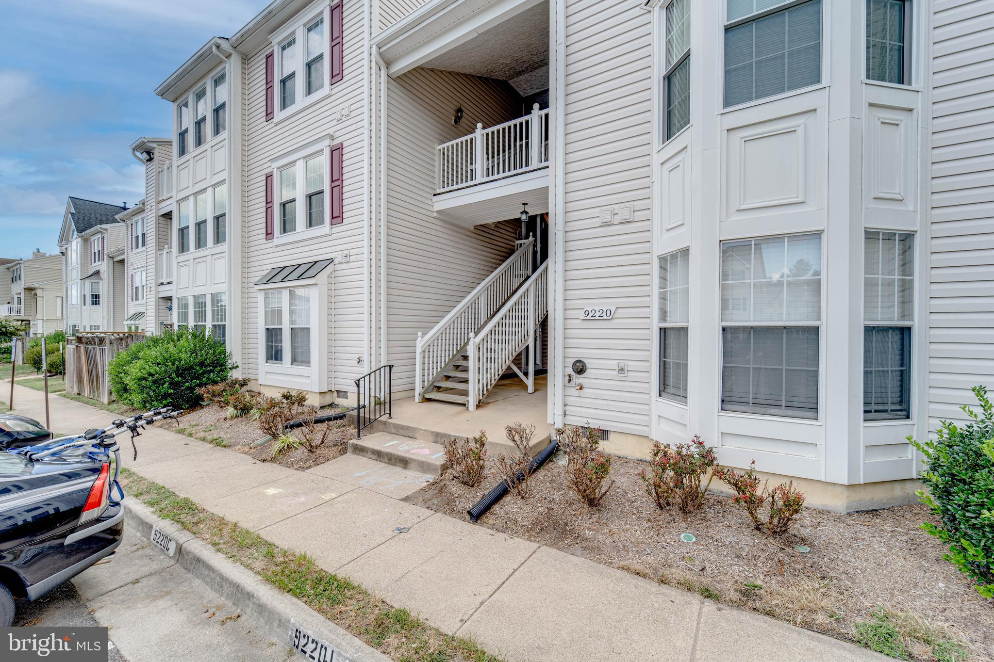 9220 Cardinal Forest Lane, Unit E Lorton, VA 22079 - Photo 26 of 26 a view of a building with many windows and plants