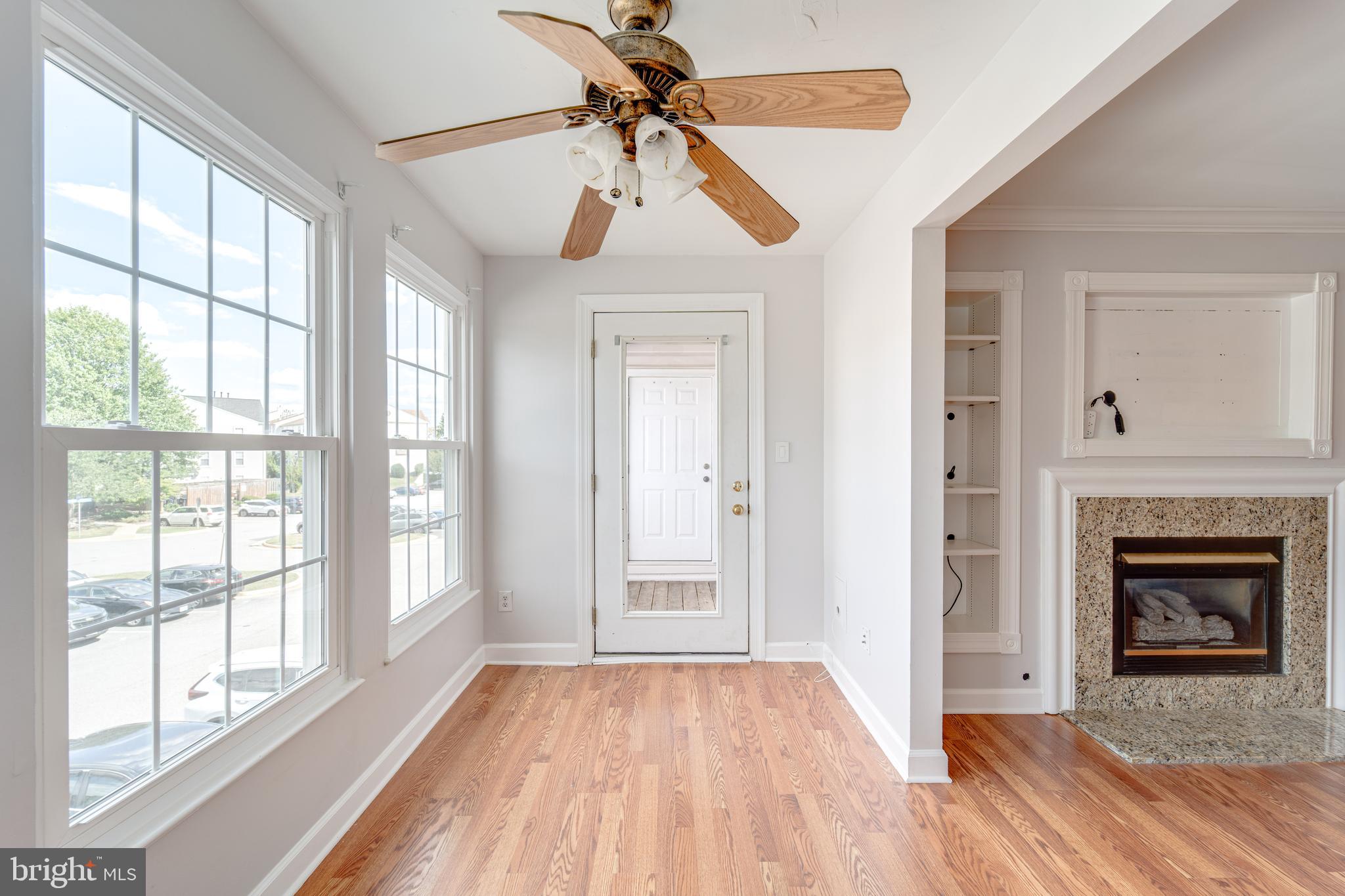 9220 Cardinal Forest Lane, Unit E Lorton, VA 22079 - Photo 7 of 26 a view of empty room with wooden floor and fan