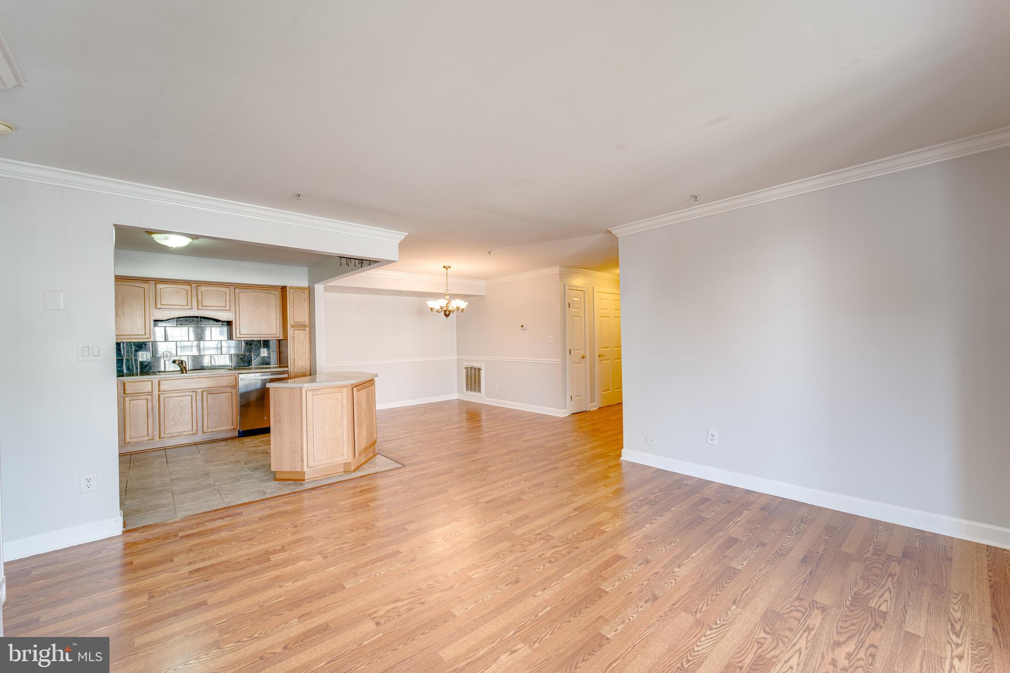9220 Cardinal Forest Lane, Unit E Lorton, VA 22079 - Photo 8 of 26 a view of kitchen and dining room with wooden floor
