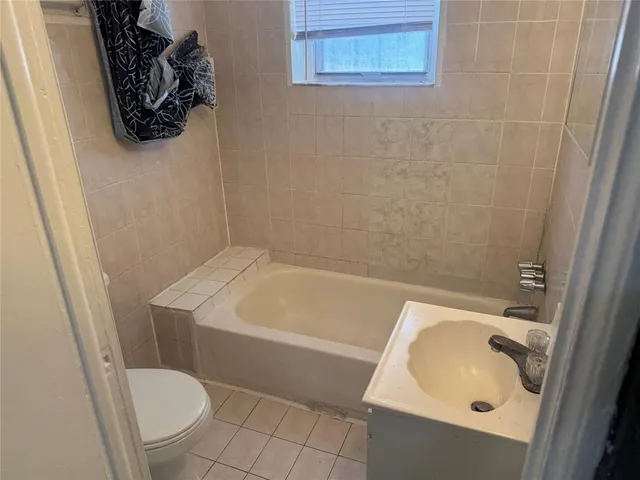 a bathroom with a toilet and a sink