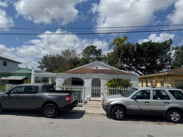 a front view of a house with parking space