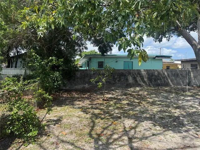 a view of balcony with wooden floor and seating space