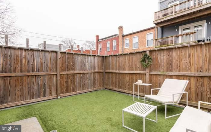 628 I Street Northeast, Unit 3 Washington, DC 20002 - Photo 9 of 32 a view of a chairs and table in the backyard