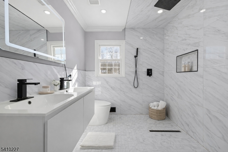444 White Oak Ridge Road Short Hills, NJ 07078 - Photo 11 of 17 a bathroom with a sink a toilet and shower