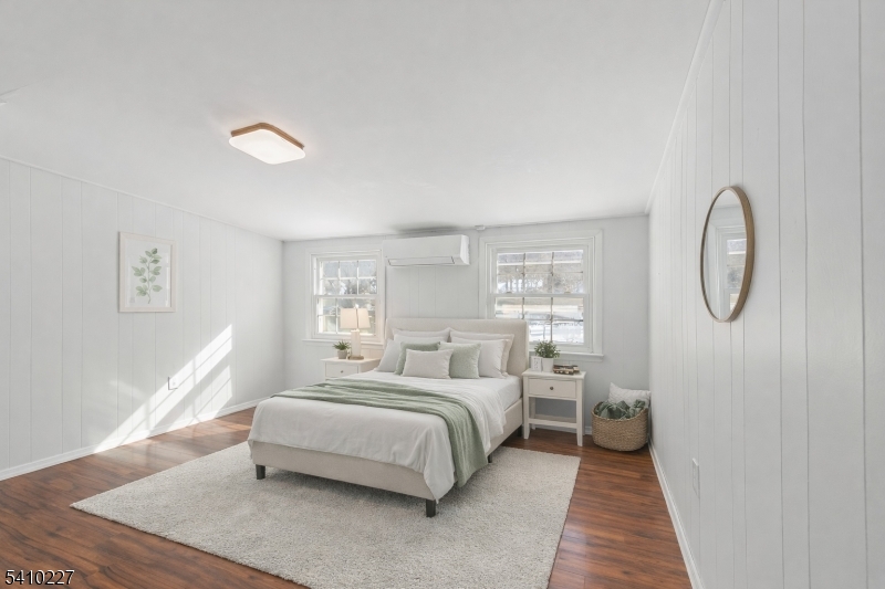 444 White Oak Ridge Road Short Hills, NJ 07078 - Photo 12 of 17 a spacious bedroom with a bed a mirror and a window