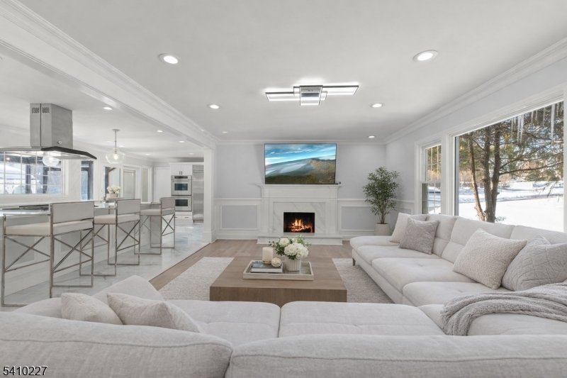 444 White Oak Ridge Road Short Hills, NJ 07078 - Photo 2 of 17 a living room with furniture fireplace and a large window