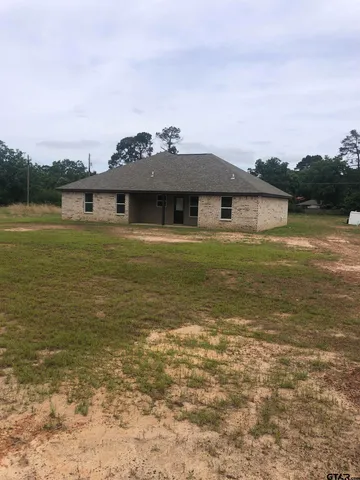 a front view of a house with a ocean view