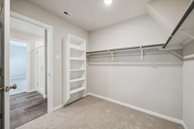 a view of an empty walk in closet