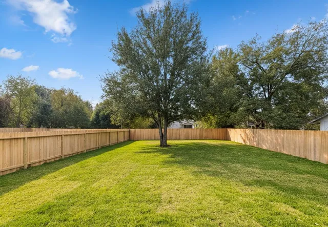 a swimming pool with an outdoor space and seating area
