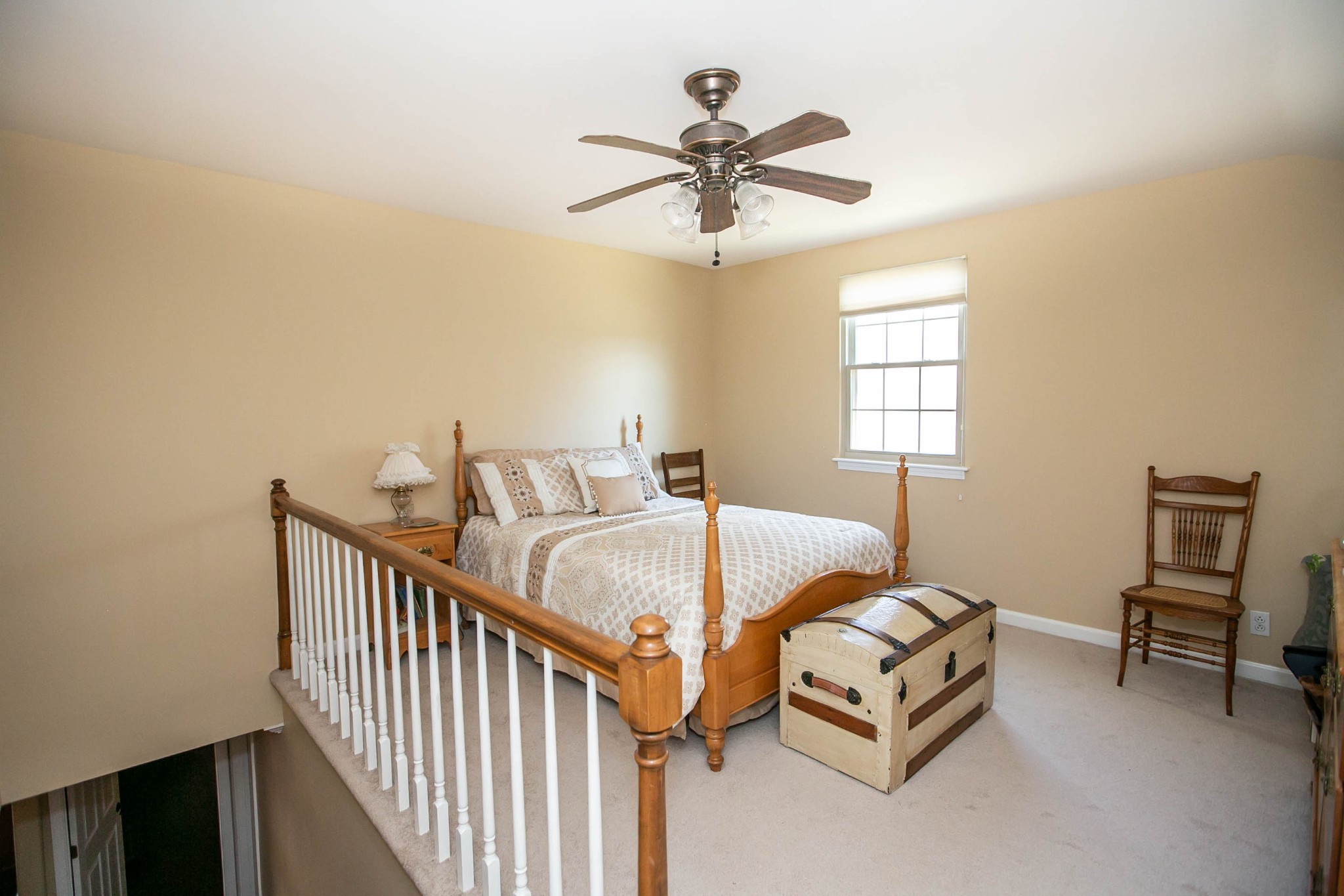1321 General George Patton Road Nashville, TN 37221 - Photo 23 of 29 a bedroom with a bed and a chandelier