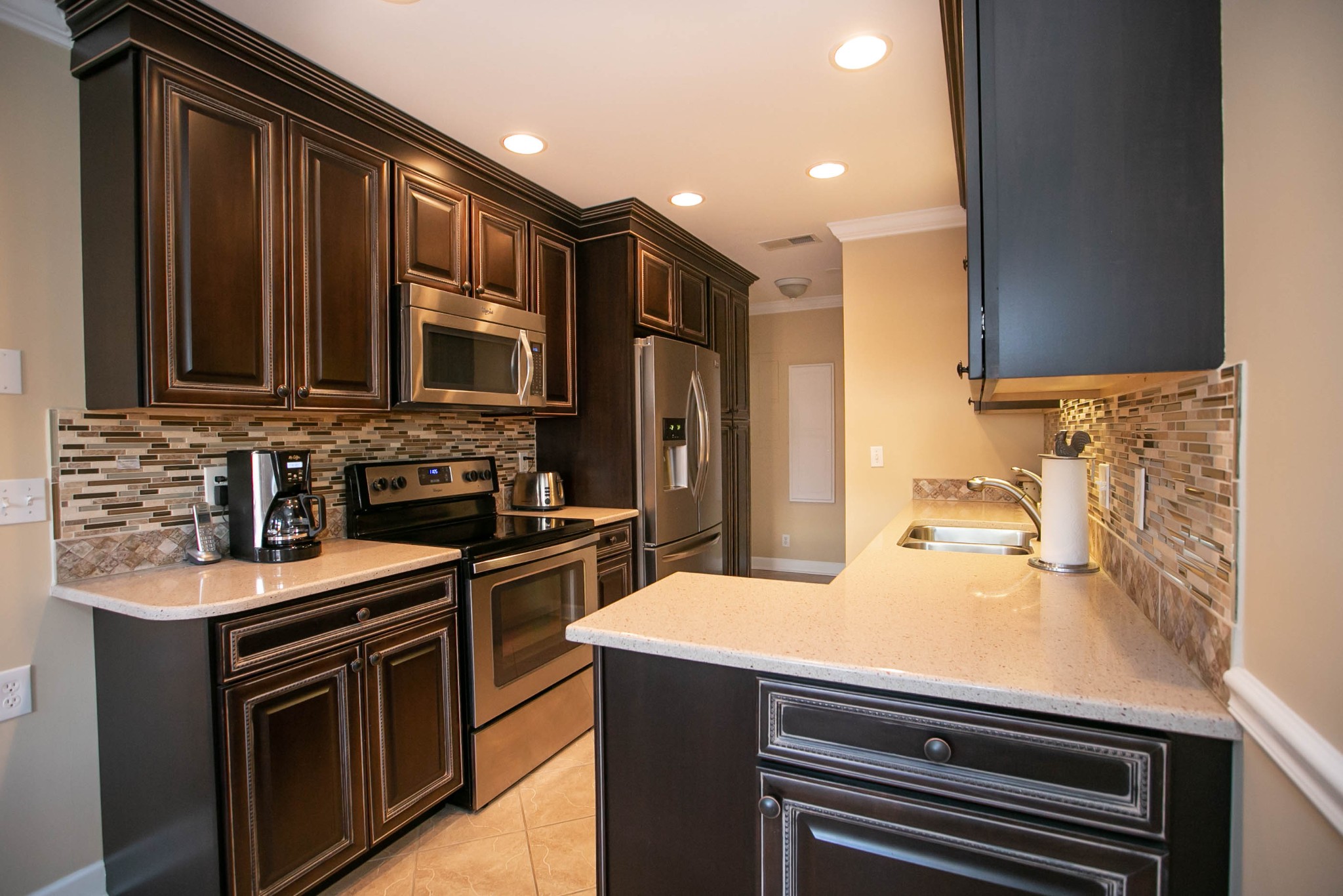 1321 General George Patton Road Nashville, TN 37221 - Photo 7 of 29 a kitchen with kitchen island granite countertop a sink stainless steel appliances and cabinets