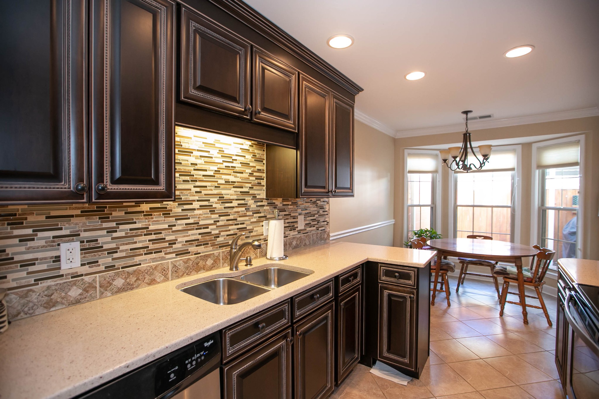 1321 General George Patton Road Nashville, TN 37221 - Photo 8 of 29 a kitchen with stainless steel appliances a sink stove and cabinets