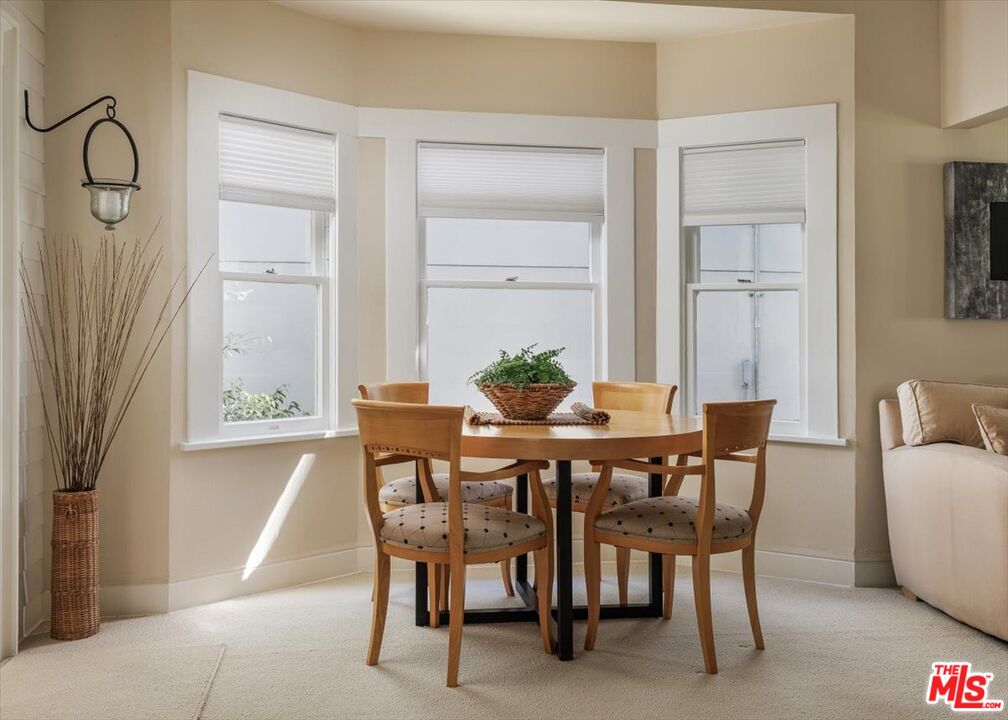 2315 Cove Avenue Los Angeles, CA 90039 - Photo 9 of 49 a view of a dining room with furniture and wooden floor