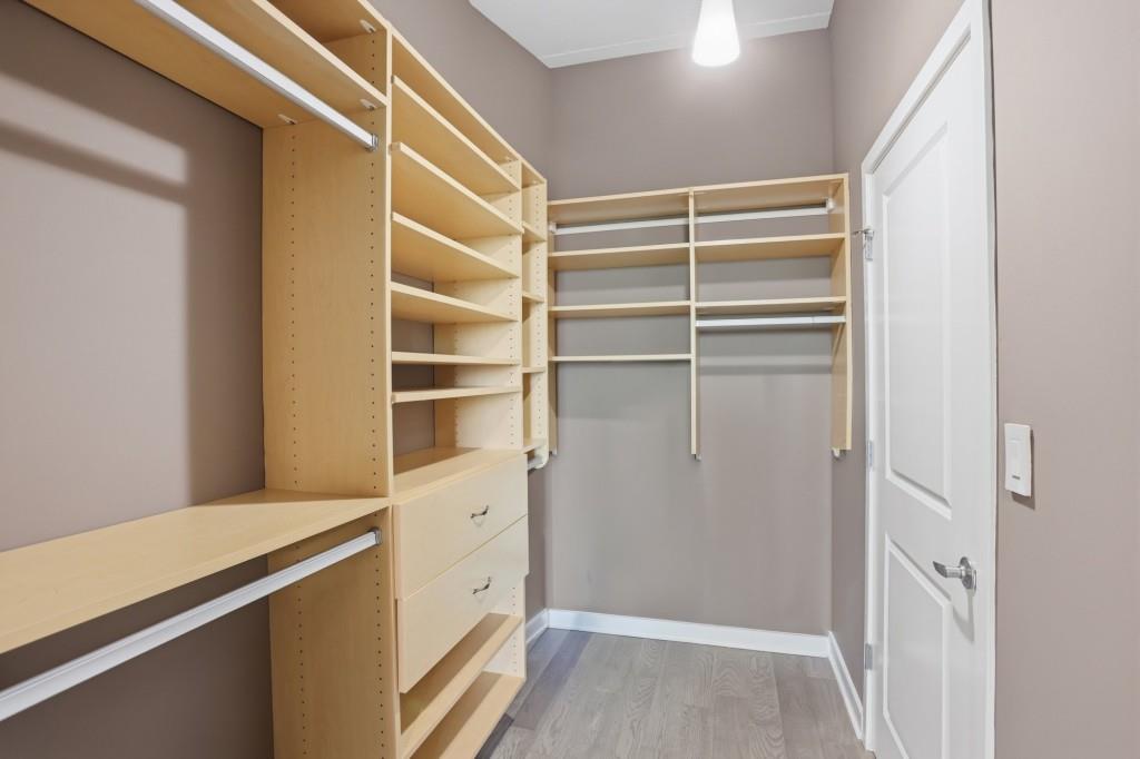 361 17th Street Northwest, Unit 1720 Atlanta, GA 30363 - Photo 15 of 38 a view of walk in closet with empty racks