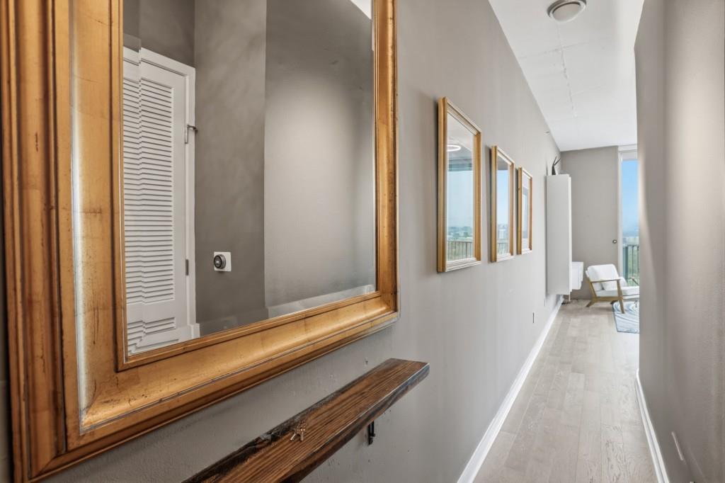 361 17th Street Northwest, Unit 1720 Atlanta, GA 30363 - Photo 24 of 38 a view of a hallway with wooden floor and staircase
