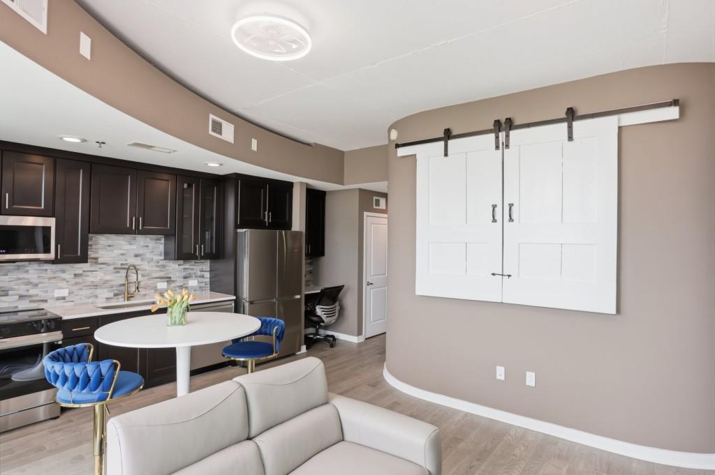 361 17th Street Northwest, Unit 1720 Atlanta, GA 30363 - Photo 27 of 38 a kitchen with a refrigerator and a table