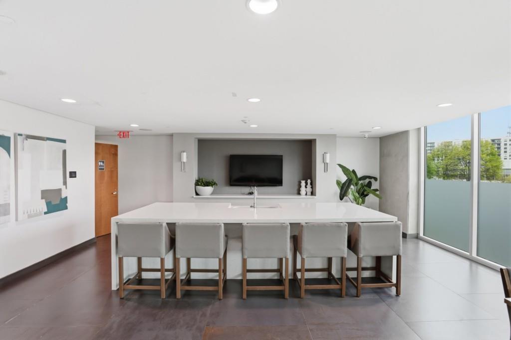 361 17th Street Northwest, Unit 1720 Atlanta, GA 30363 - Photo 29 of 38 a view of a dining room with furniture and wooden floor