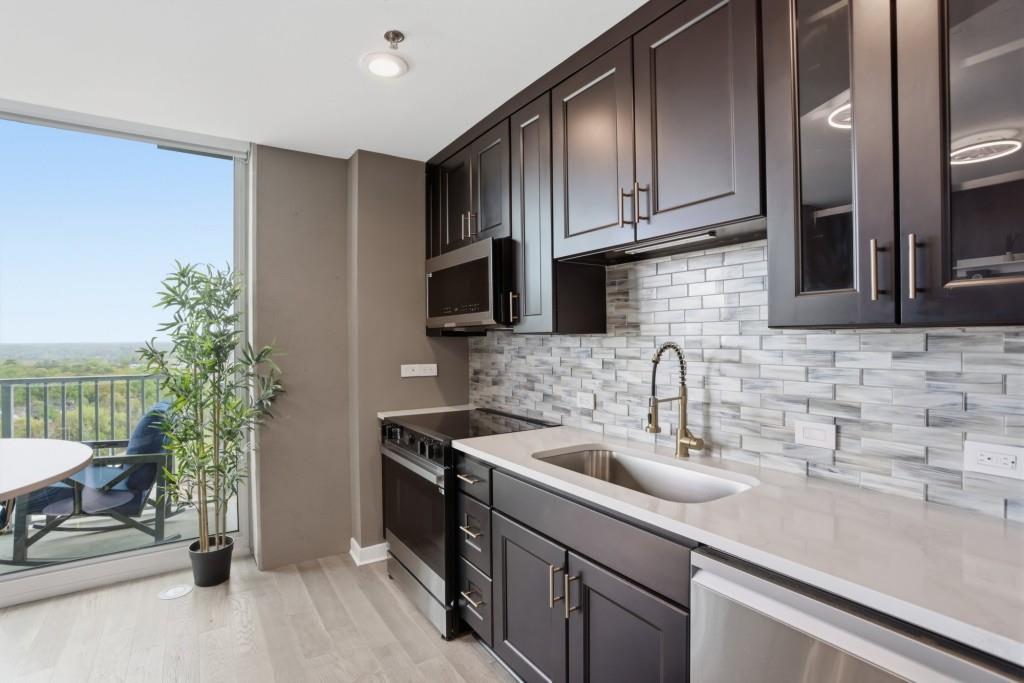 361 17th Street Northwest, Unit 1720 Atlanta, GA 30363 - Photo 5 of 38 a kitchen with a sink and cabinets