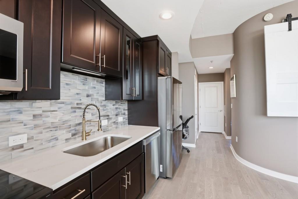361 17th Street Northwest, Unit 1720 Atlanta, GA 30363 - Photo 6 of 38 a kitchen with stainless steel appliances a sink stove and refrigerator