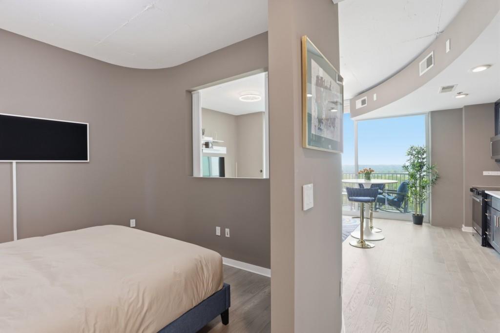 361 17th Street Northwest, Unit 1720 Atlanta, GA 30363 - Photo 10 of 38 a bedroom with a bed and a table