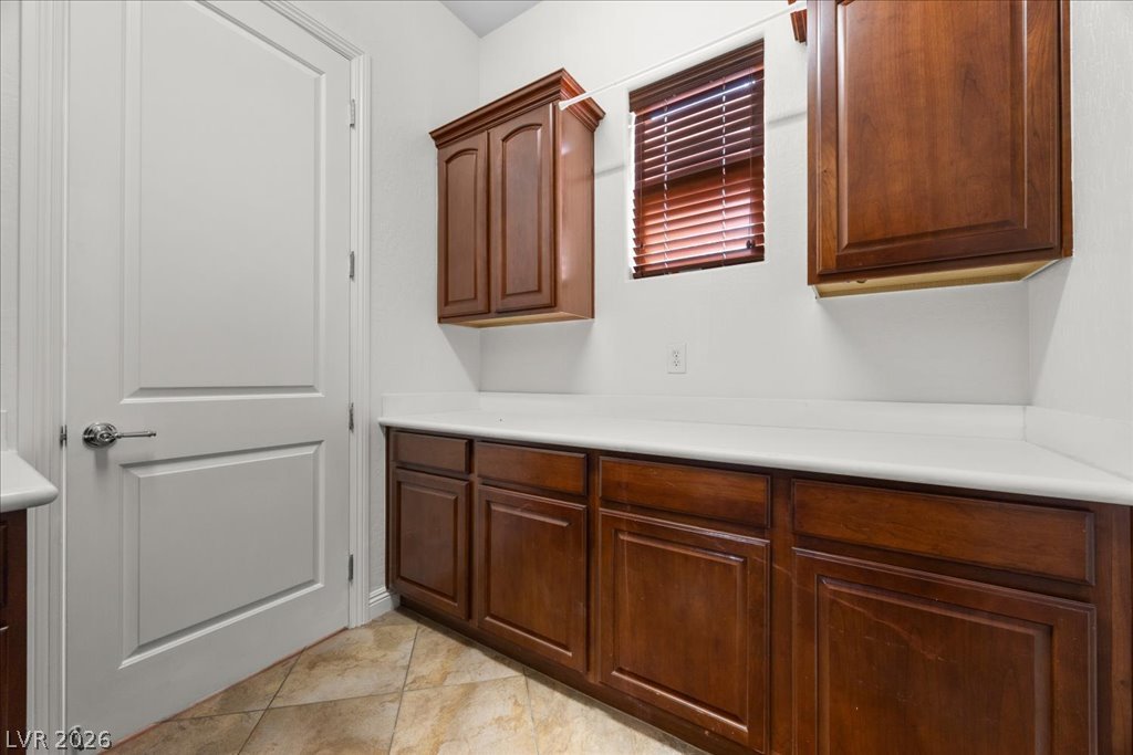 2125 De Rouge Avenue Henderson, NV 89044 - Photo 67 of 96 Ample counter space and rich cabinetry define this practical laundry area.