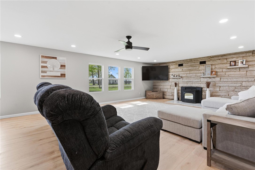 2950 Fairfield Pike Springfield, OH 45502 - Photo 10 of 48 This inviting living room features a charming stone fireplace and abundant natural light.