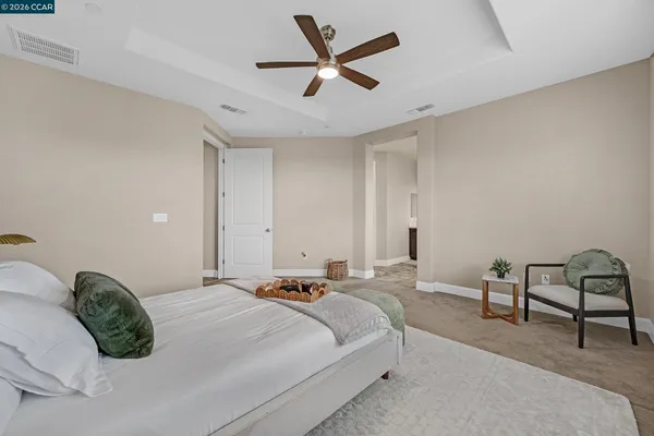 a bedroom with a bed and a desk