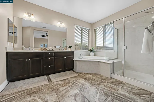 a room with a sink vanity and a mirror