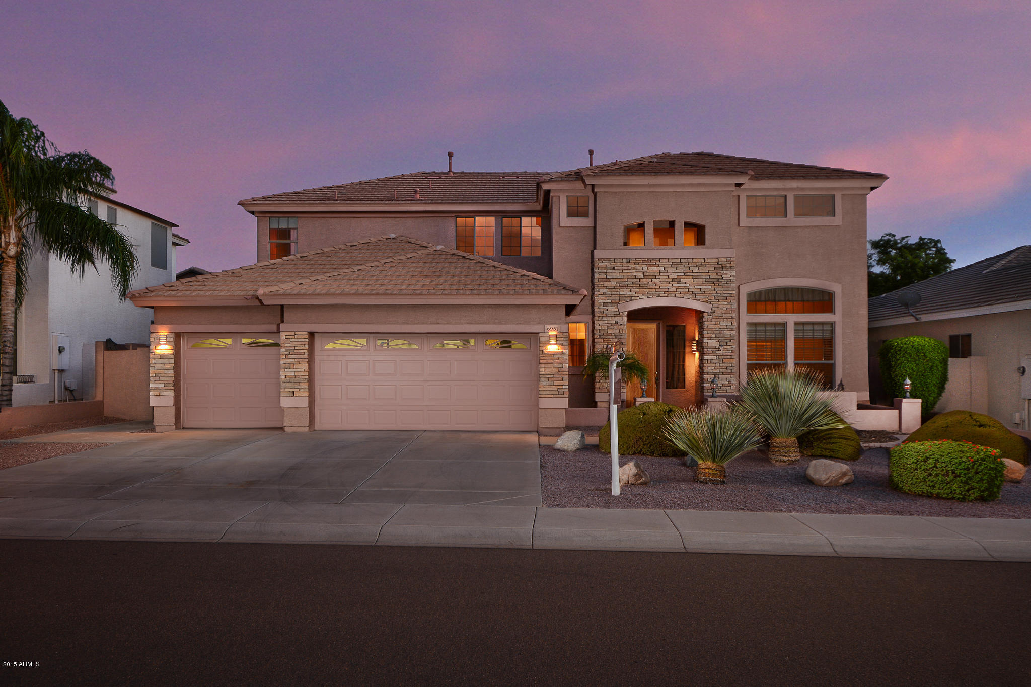 6931 West Rowel Road Peoria, AZ 85383 - Photo 1 of 44 00-FRONT OF HOME TWILIGHT