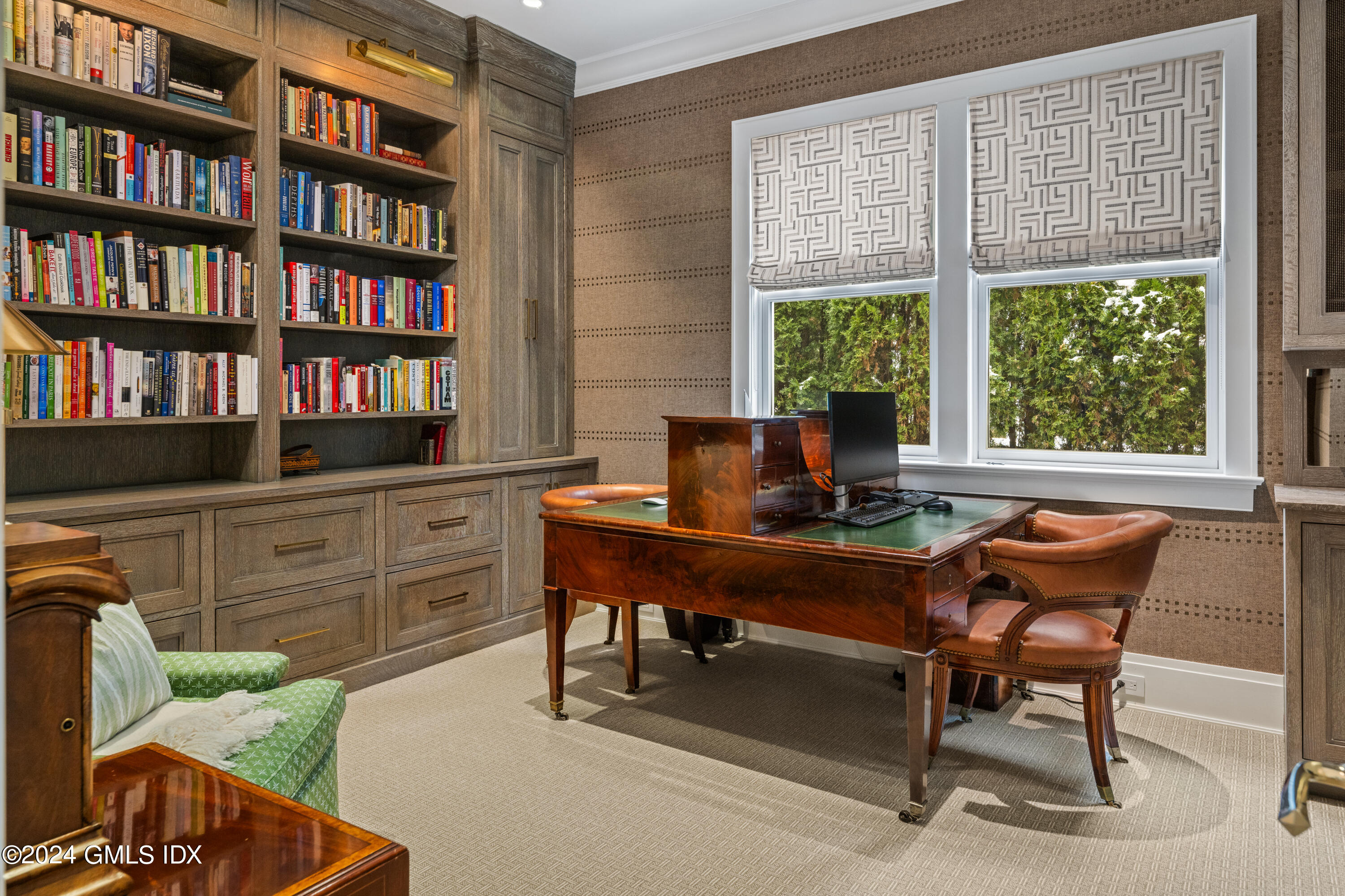 2 Oneida Drive, Unit F Greenwich, CT 06830 - Photo 12 of 31 a view of a workspace with furniture and a bookshelf