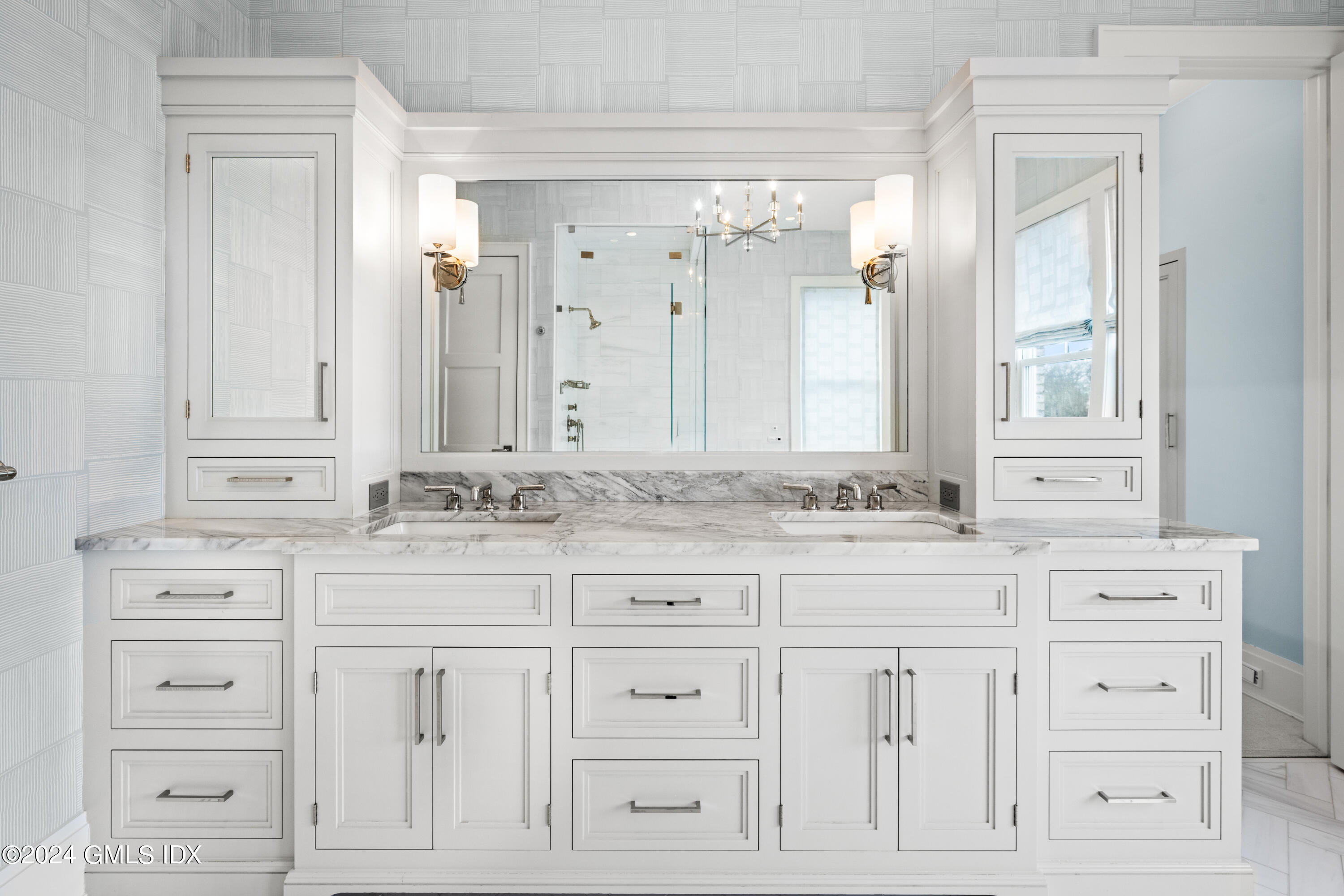 2 Oneida Drive, Unit F Greenwich, CT 06830 - Photo 17 of 31 a bathroom with white cabinets
