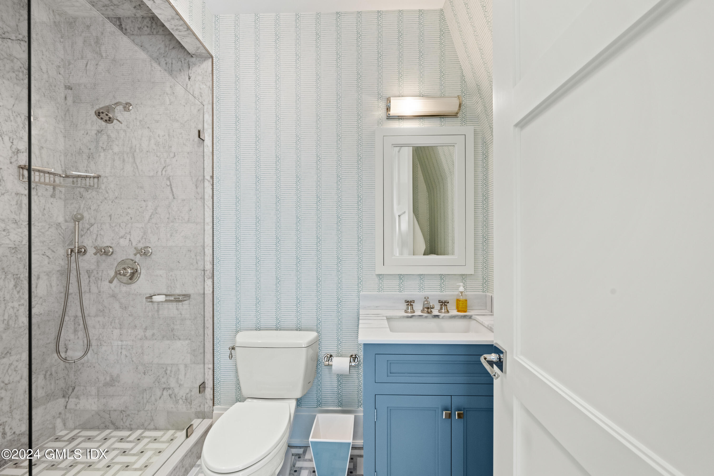 2 Oneida Drive, Unit F Greenwich, CT 06830 - Photo 21 of 31 a bathroom with a toilet a sink and shower