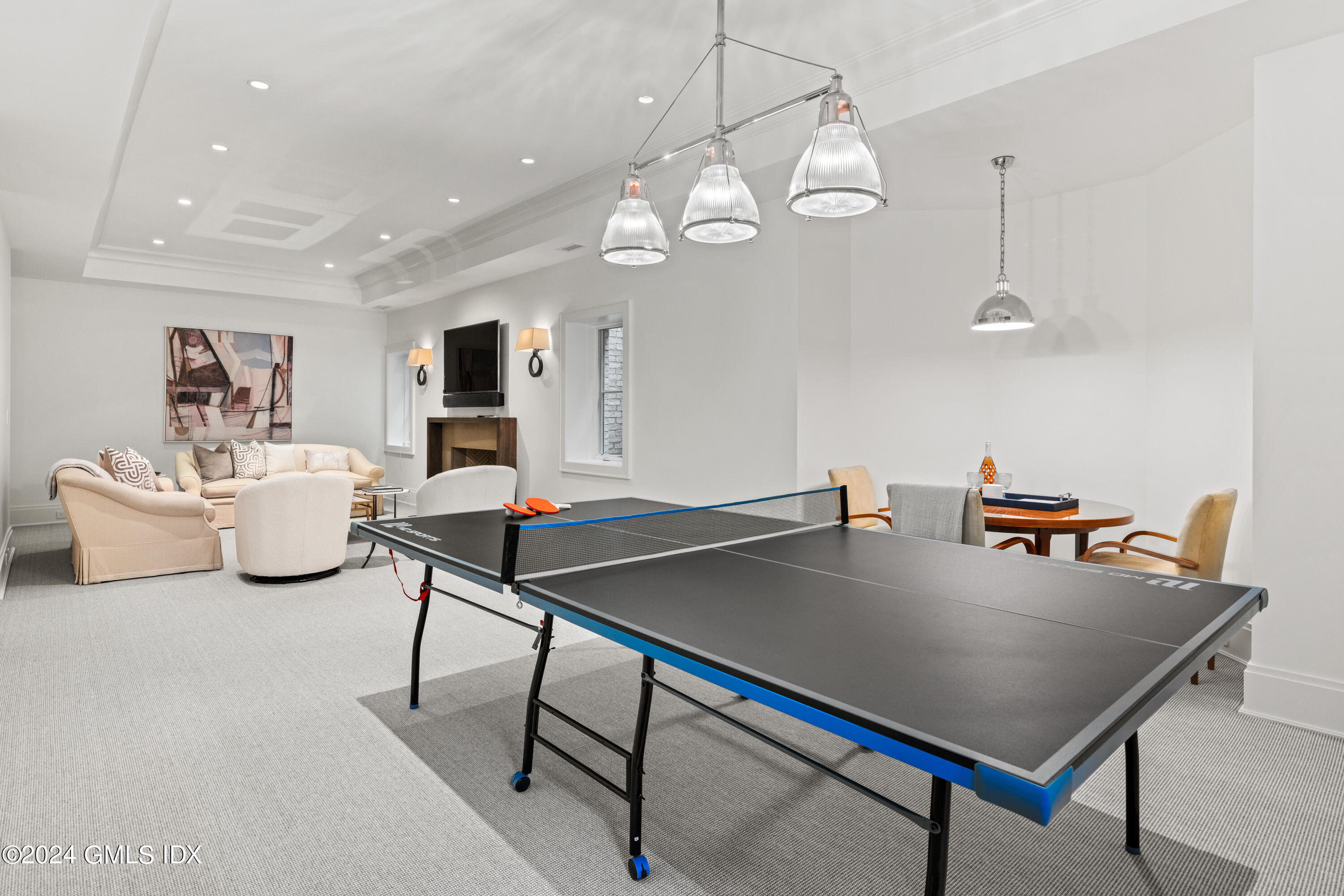 2 Oneida Drive, Unit F Greenwich, CT 06830 - Photo 24 of 31 a living room with furniture a chandelier and pool table