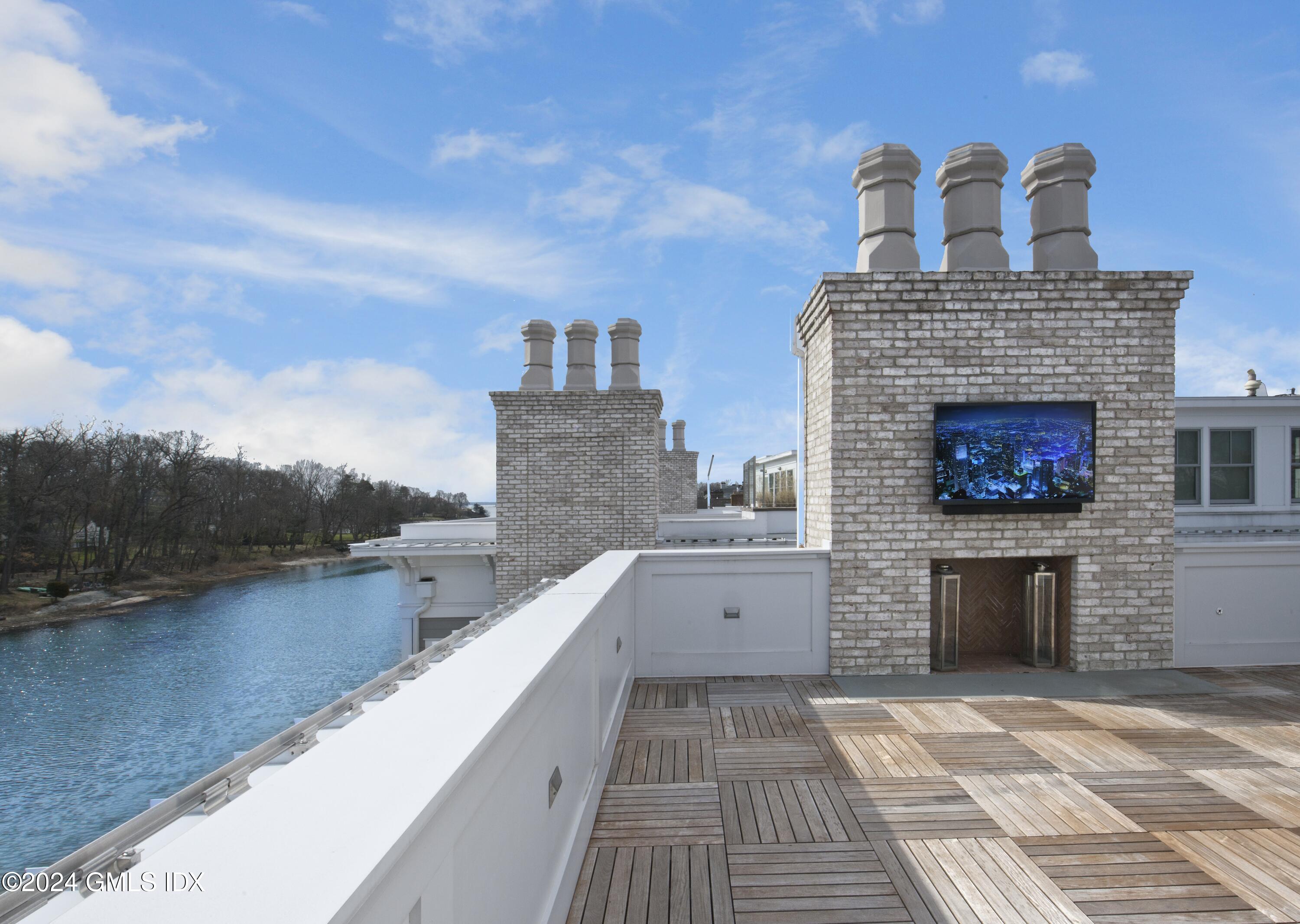 2 Oneida Drive, Unit F Greenwich, CT 06830 - Photo 25 of 31 a view of a terrace with a sink