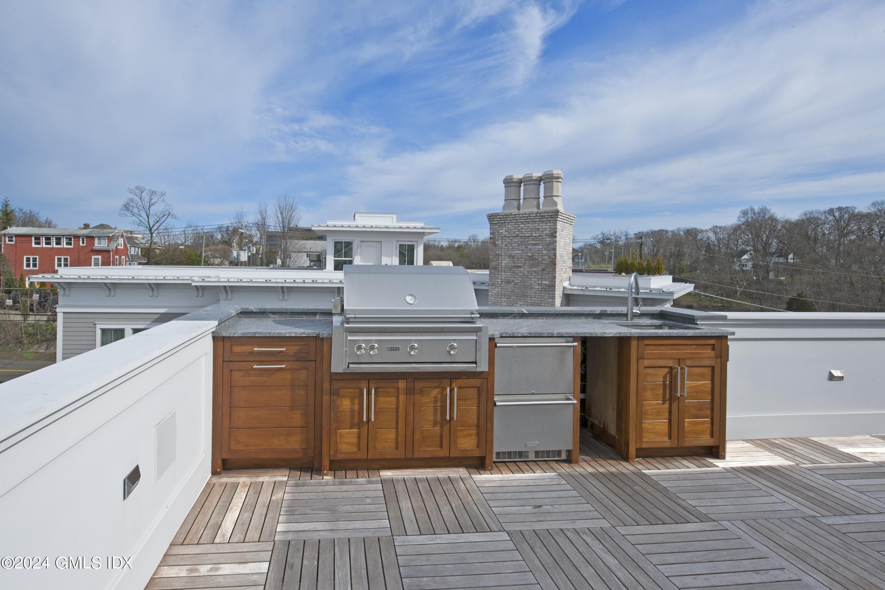 2 Oneida Drive, Unit F Greenwich, CT 06830 - Photo 26 of 31 a view of a terrace with a sink