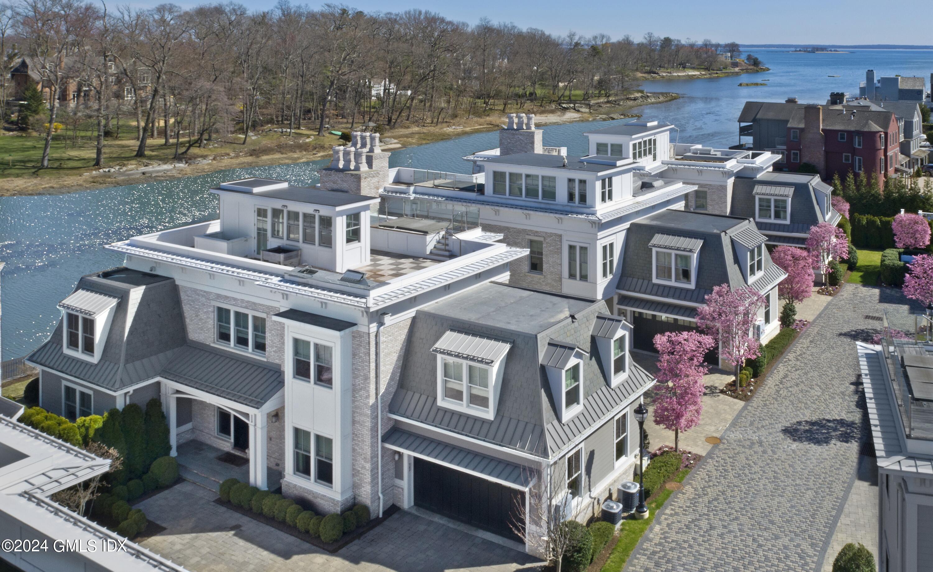 2 Oneida Drive, Unit F Greenwich, CT 06830 - Photo 27 of 31 an aerial view of a house with a yard