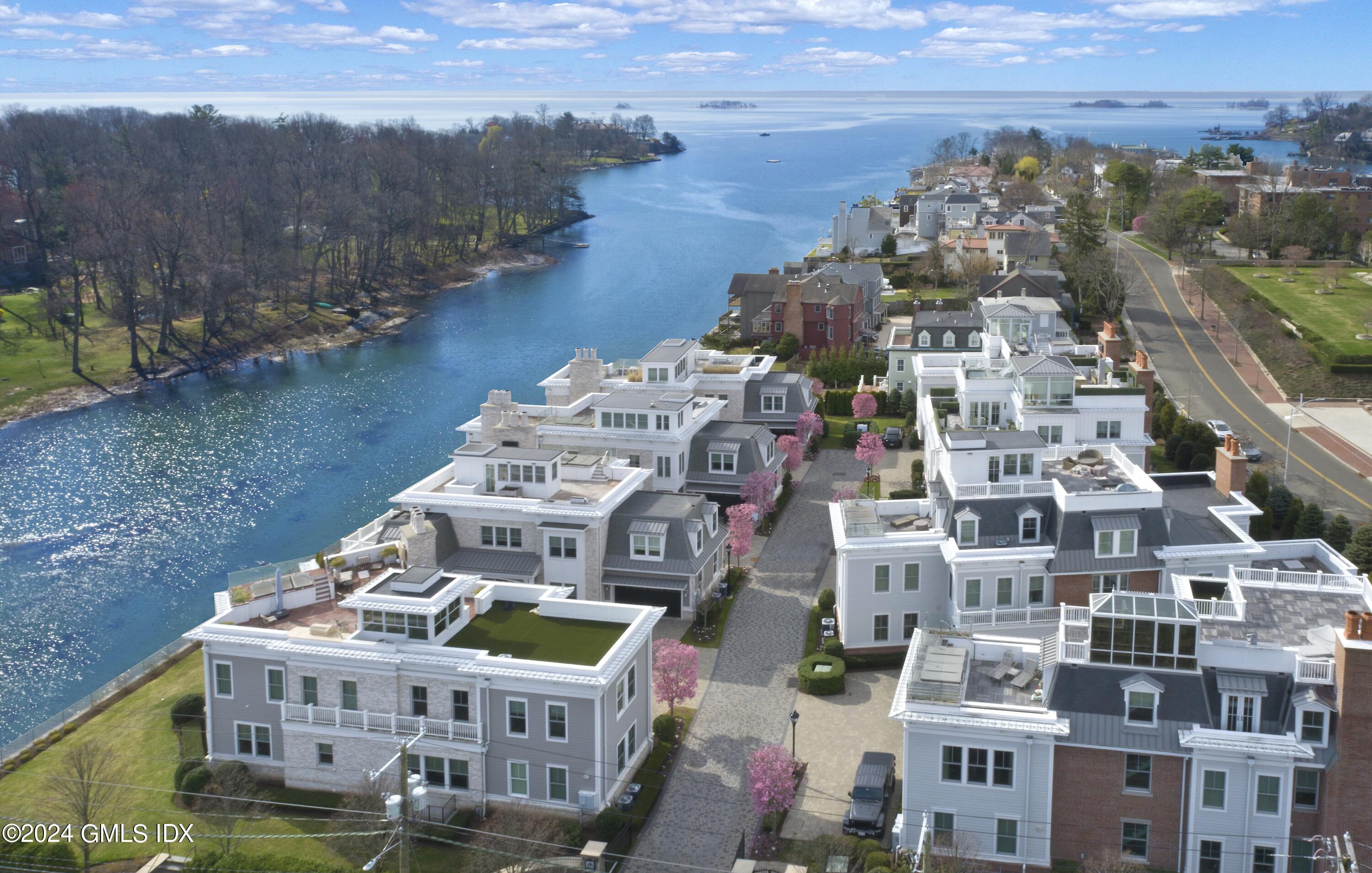 2 Oneida Drive, Unit F Greenwich, CT 06830 - Photo 3 of 31 a large building with a clock tower in the middle
