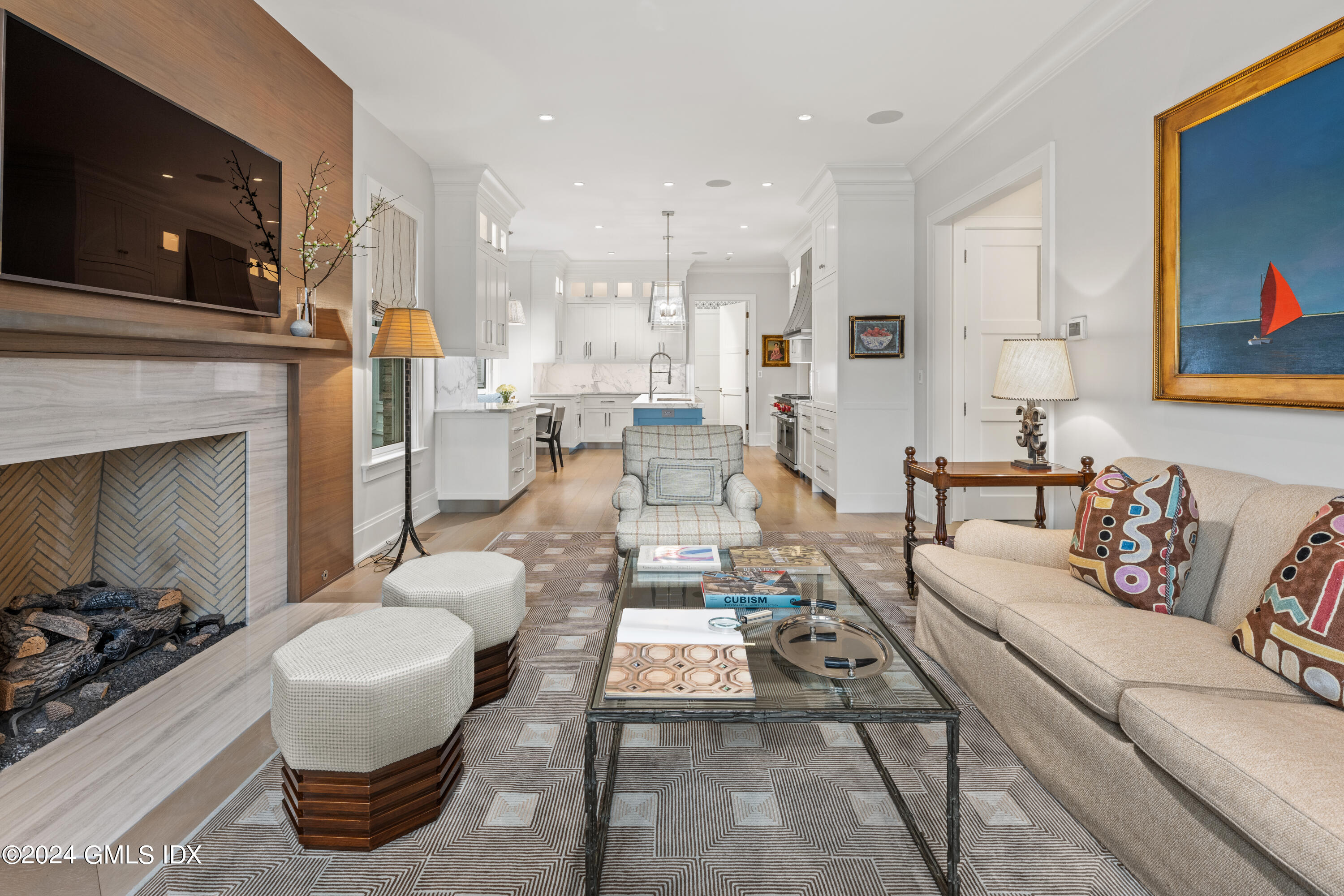 2 Oneida Drive, Unit F Greenwich, CT 06830 - Photo 6 of 31 a living room with furniture a flat screen tv and a fireplace