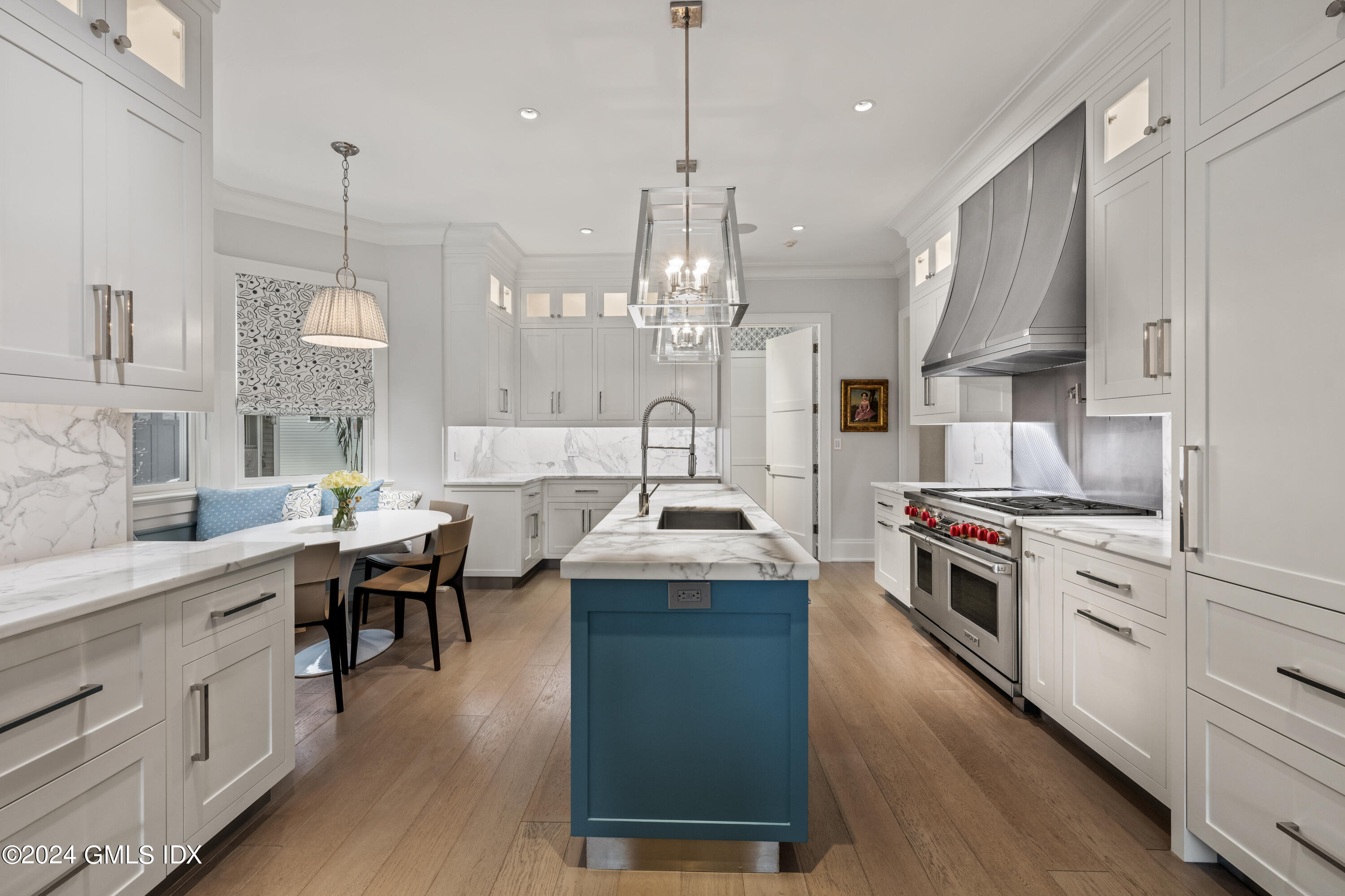 2 Oneida Drive, Unit F Greenwich, CT 06830 - Photo 8 of 31 a kitchen with granite countertop a sink a stove a dining table and chairs