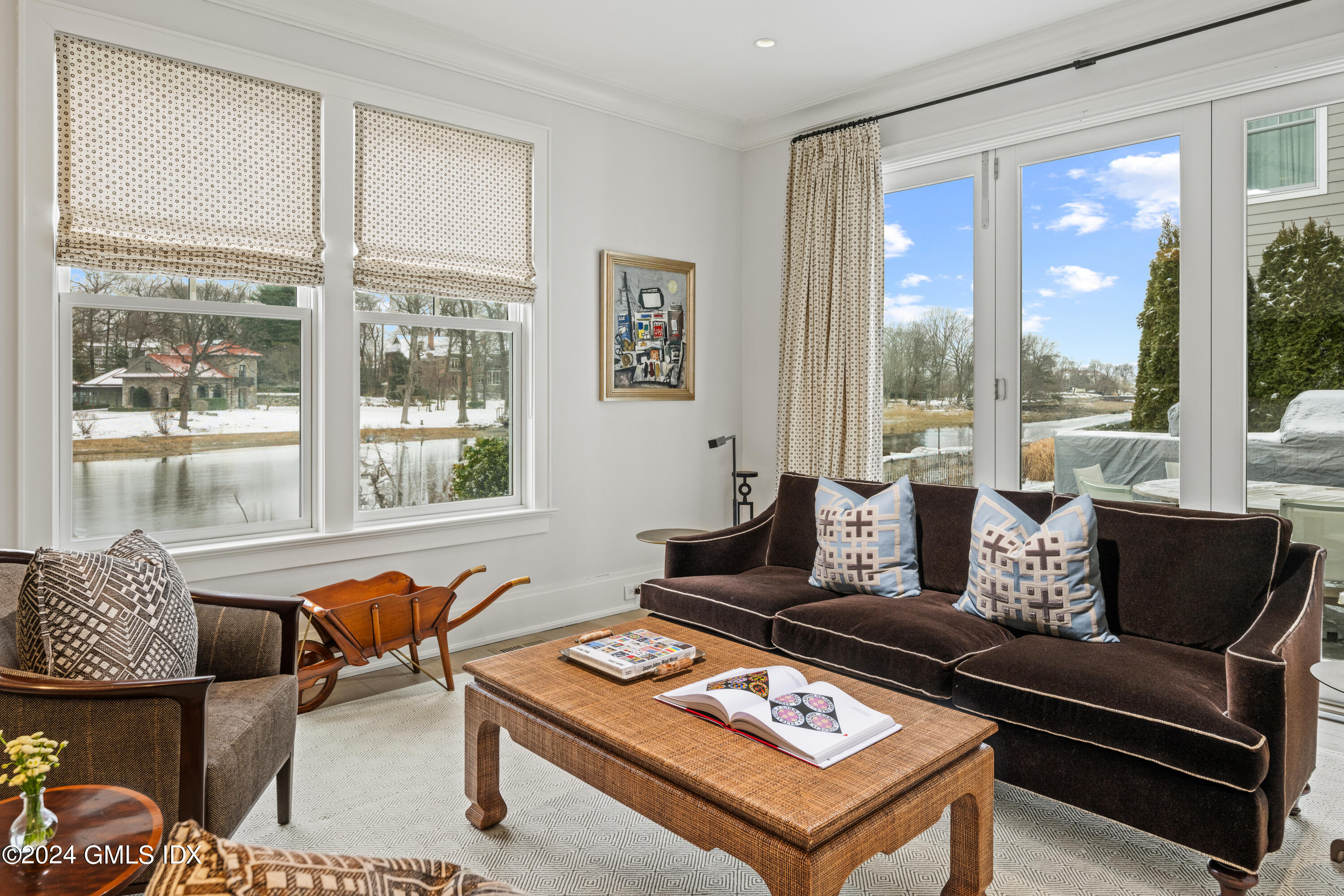 2 Oneida Drive, Unit F Greenwich, CT 06830 - Photo 10 of 31 a living room with furniture and a floor to ceiling window